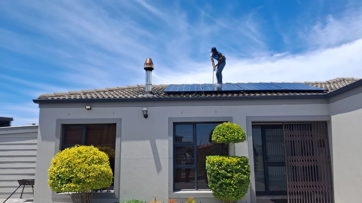 Solar installation crew working on a residential roof in Durham, NC