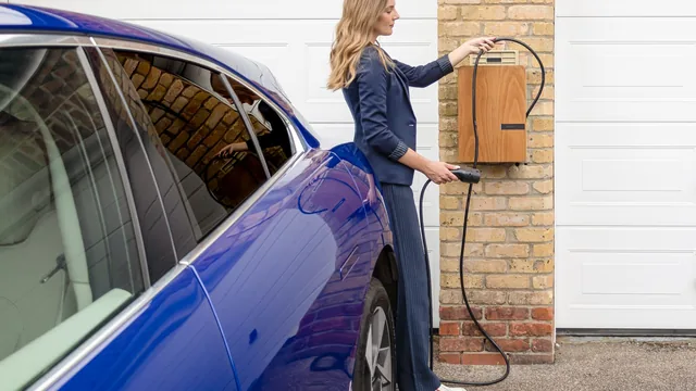 Level 2 EV charger on a garage wall in Durham, NC
