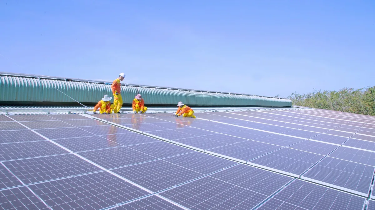 Solar installers on a home roof in Durham, NC